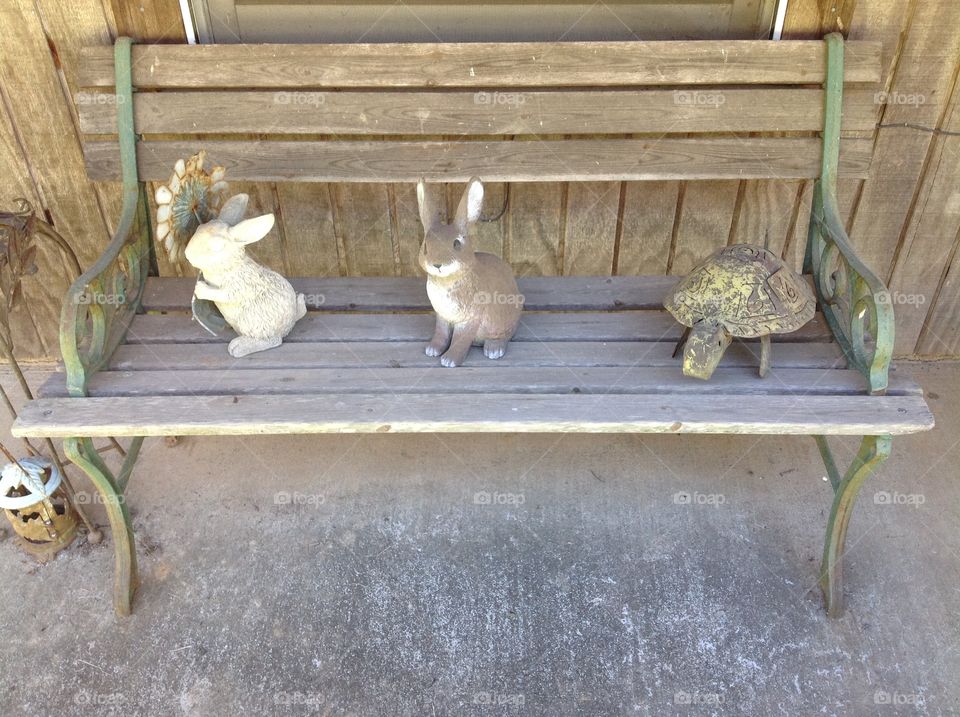 Rustic Outdoor Bench with Animal Decor