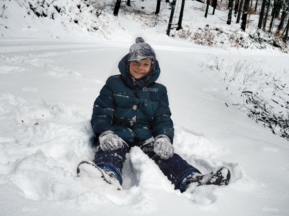 Happy boy enjoying in winter