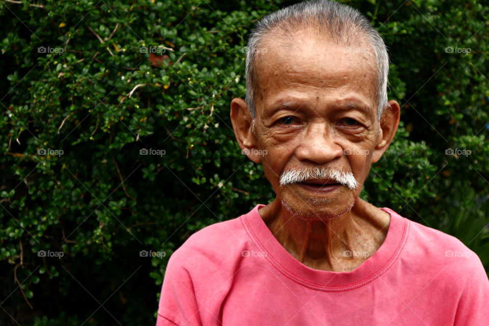 portrait of an adult Filipino man