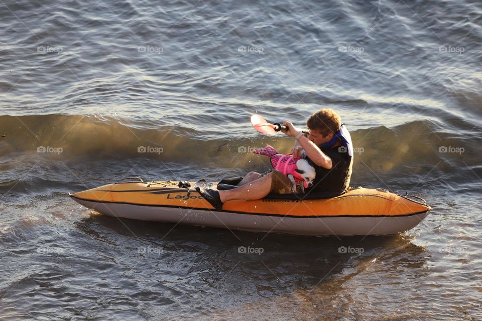 Scared dog in kayaker's lap