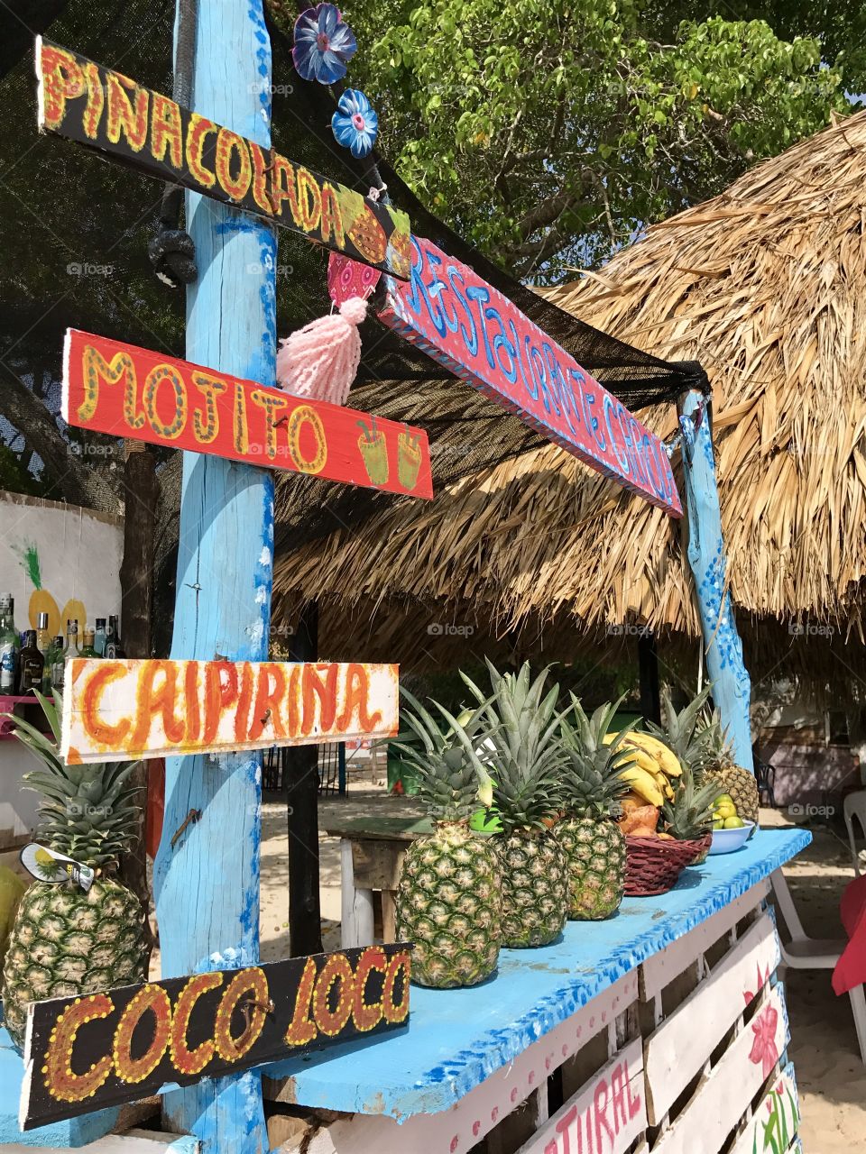 Upclose of bar hut and fruits at Playa Blanca, Colombia