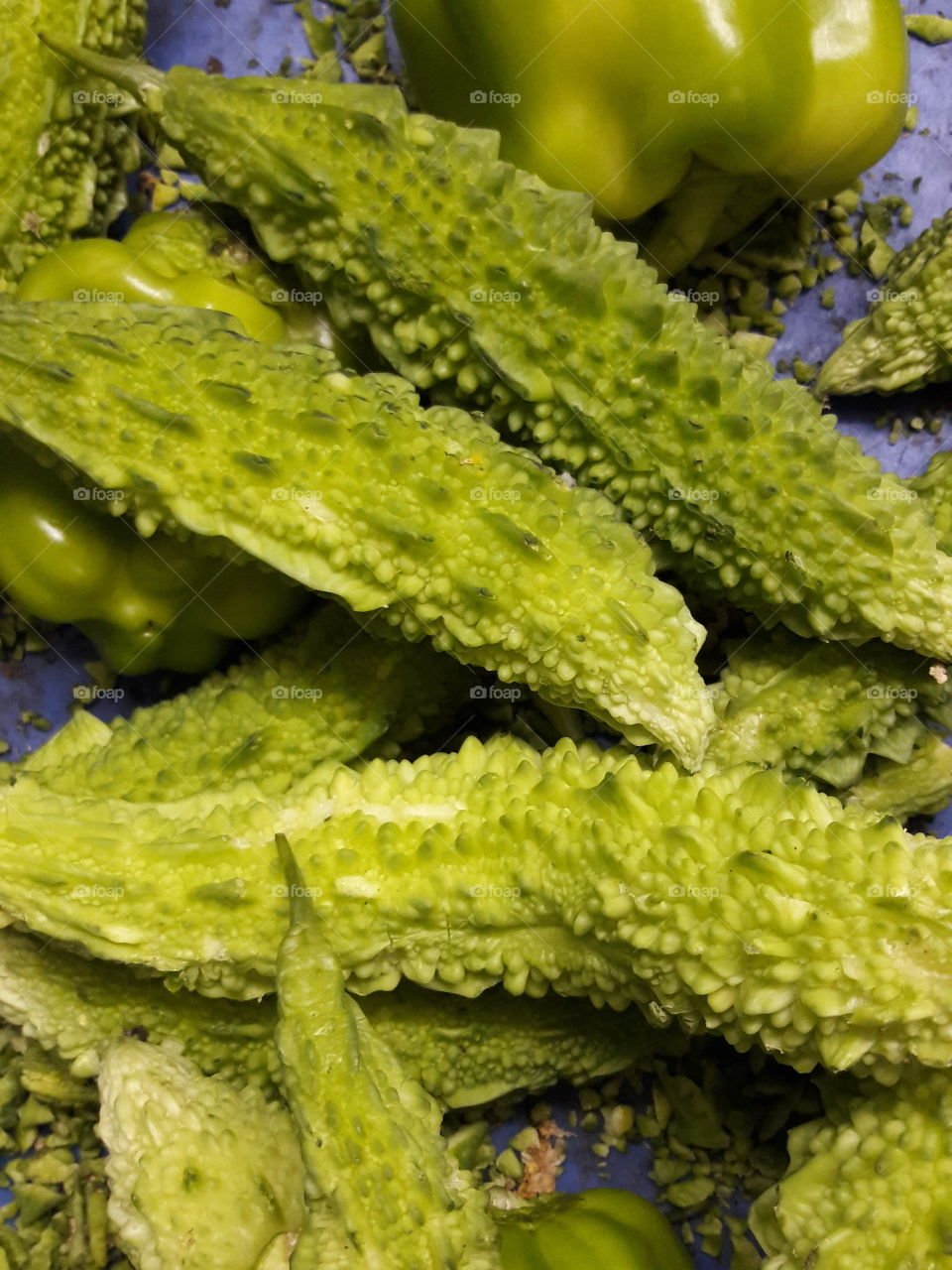 karela bitter goad goard raw green vegetable capsicum pepper bell closeup