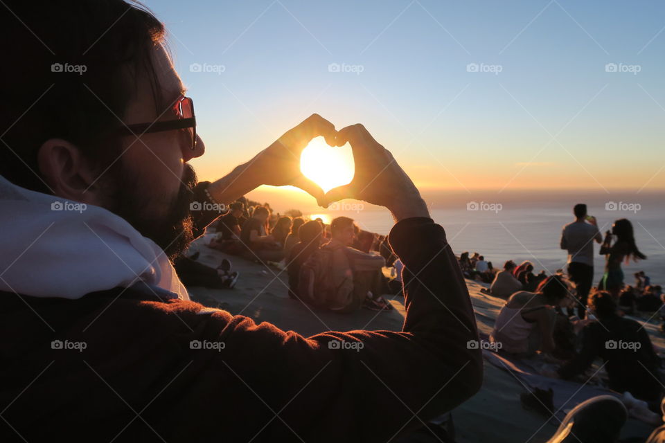 My heart around the setting sun on top of signal mountain in Cape Town, South Africa. 