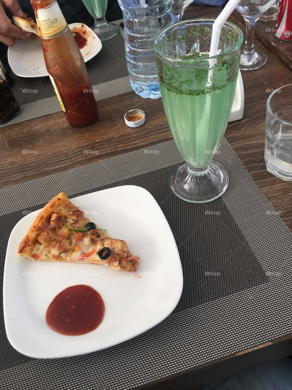 Pizza slice and margarita juice 