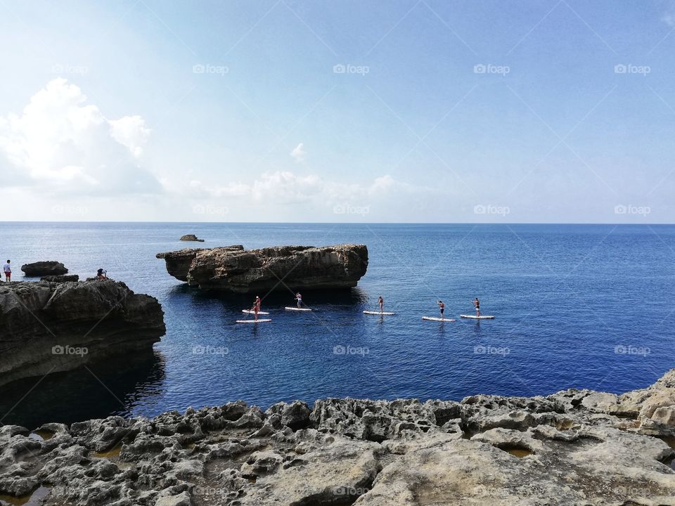 Boys SUP in the wonderful waters of Dwejra(Malta)