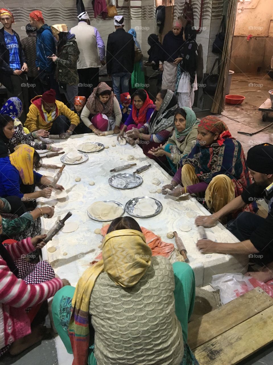 Making chapati to feed the needy at a Sikh temple in Old Delhi, India.