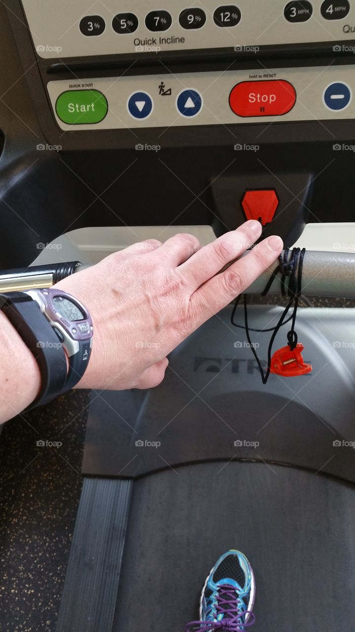 Treadmill - hand touching  safety hook.