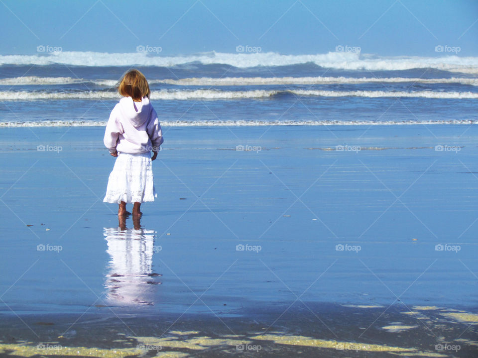 Little girl, big ocean.
