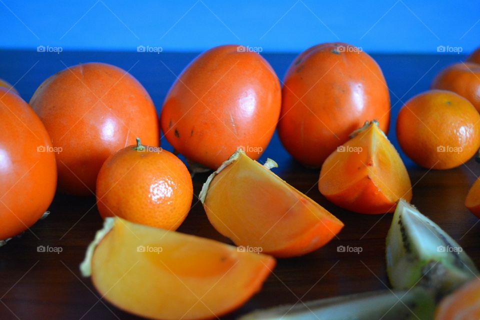 tropics fruits healthy food wood background