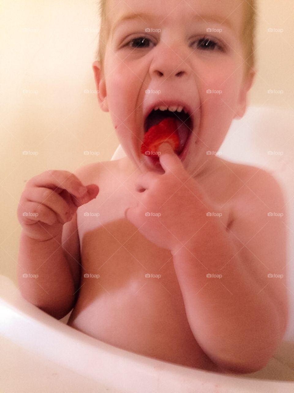 Big boy eating strawberries. 