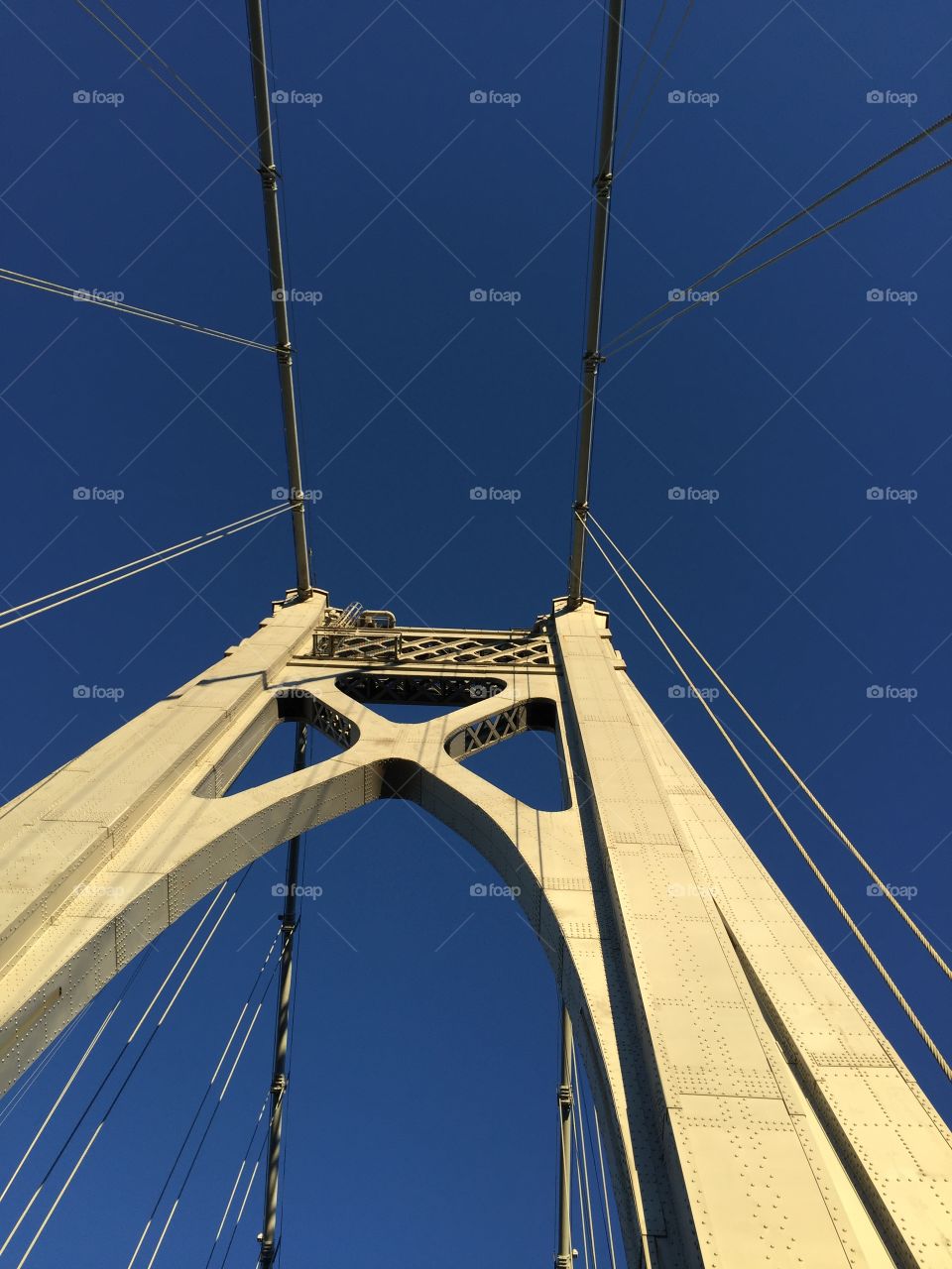 Looking up at a bridge. 