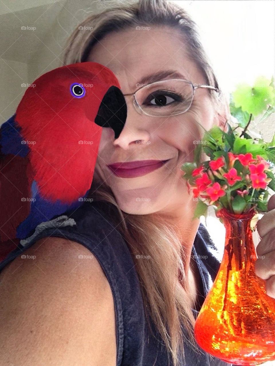 Woman sharing a loving moment with her parrot.