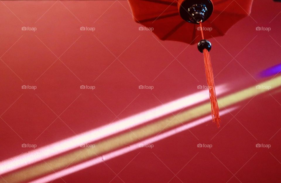 Chinese red lantern on red background and colourful  ray of light