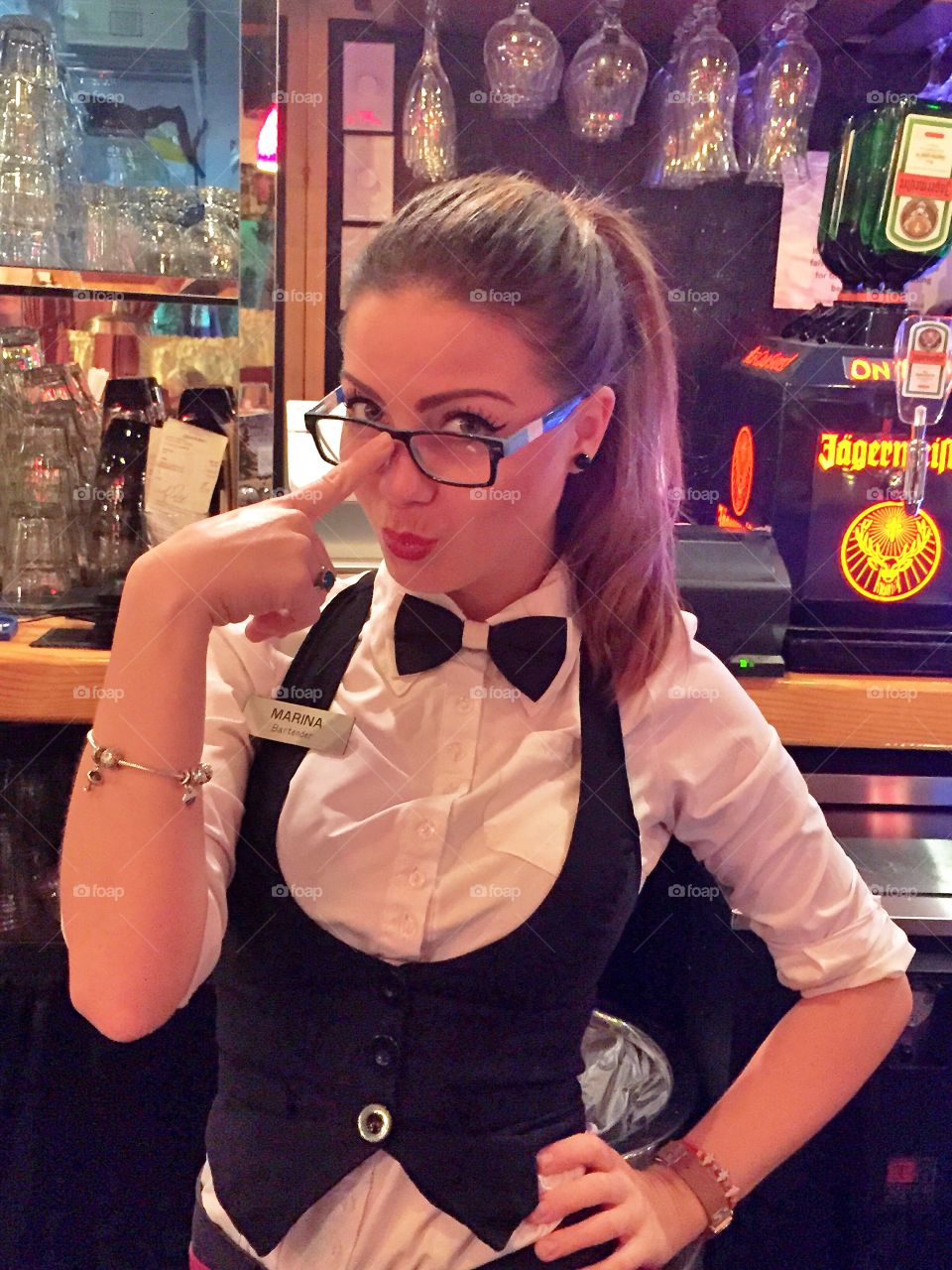 A coquettish female bartender.