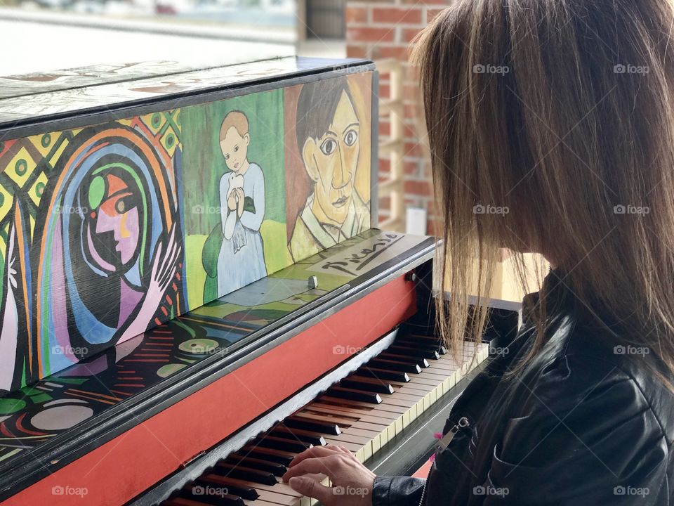 Woman playing artistic piano 
