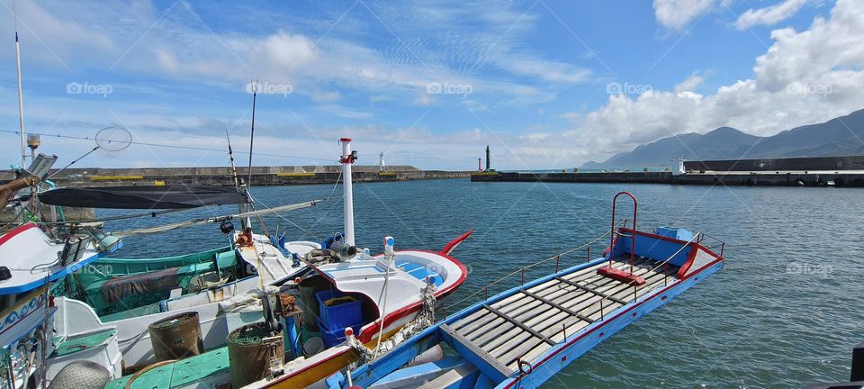 boats moored in fishing port