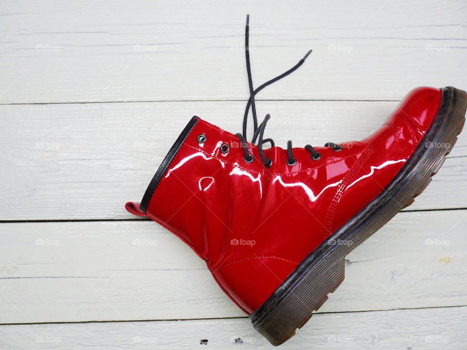 red women's shoe on a white background