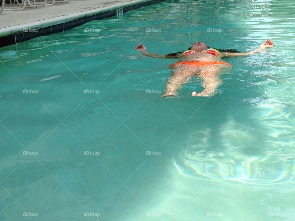 Floating in the pool