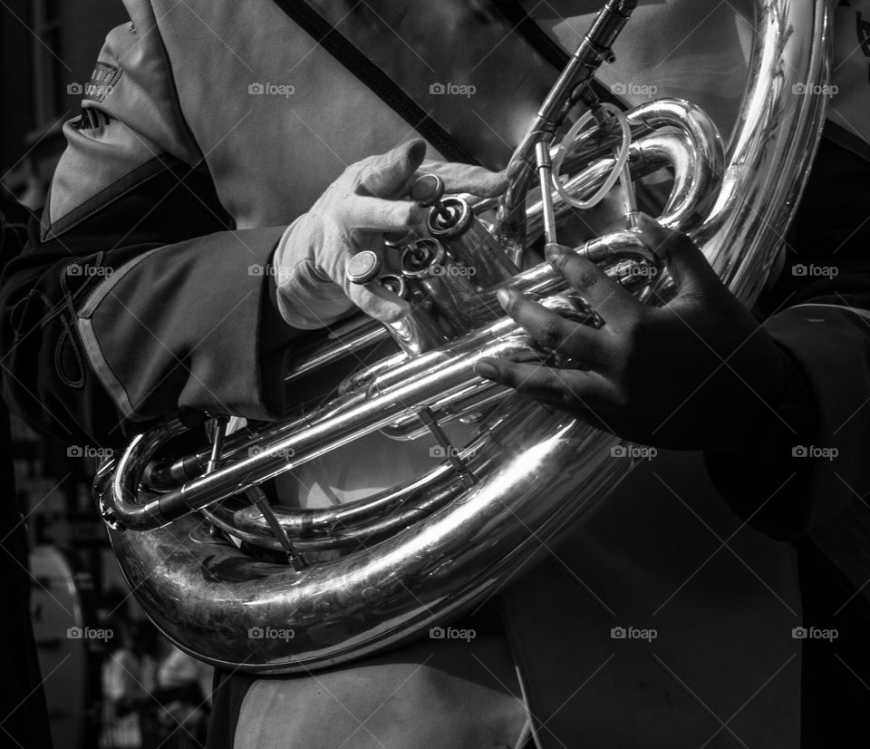 Closeup of tuba being played in a marching band