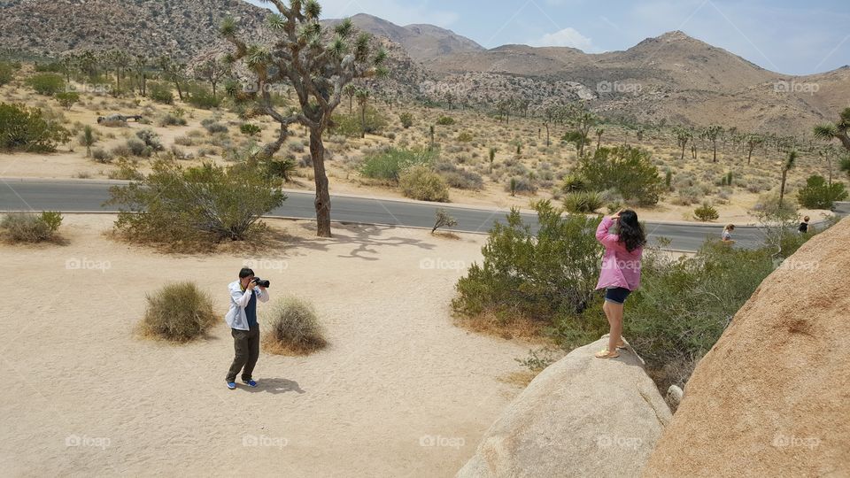 got a shot of a couple taking pictures using one of the rocks in Joshua Tree Park