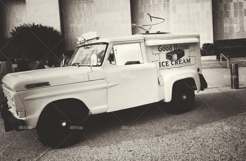 Old fashioned car parked on street sells ice cream 