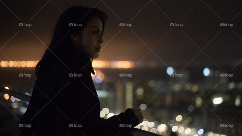 Standing on a crane in the Rain looking down at the city at heights that are insane.