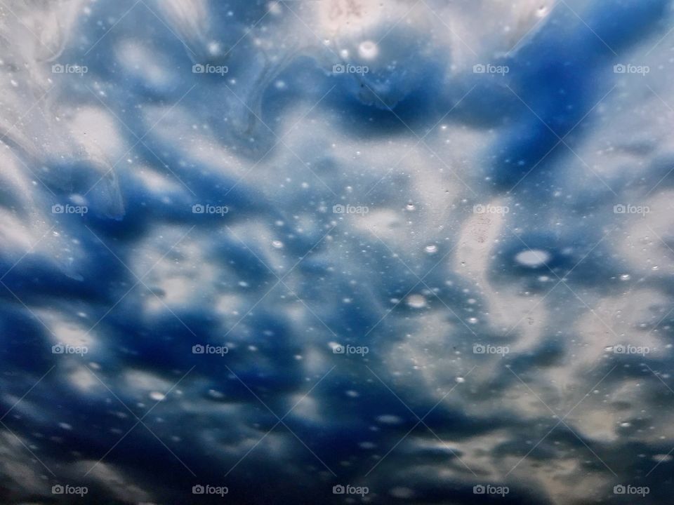 Blue soap suds in car wash 