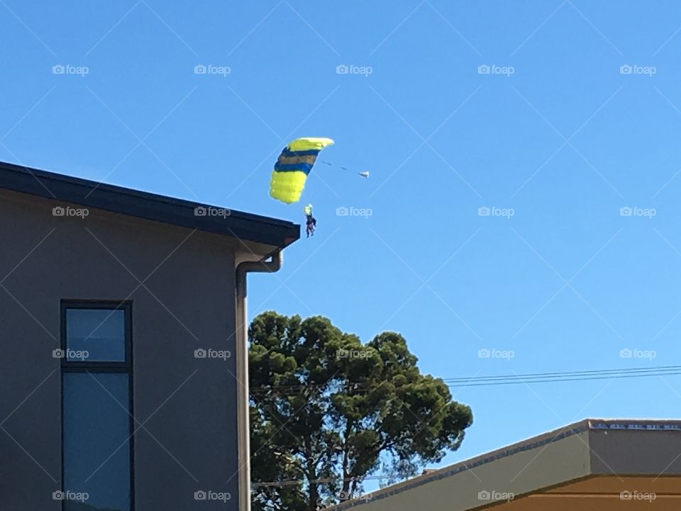 Parachutist landing in urban area