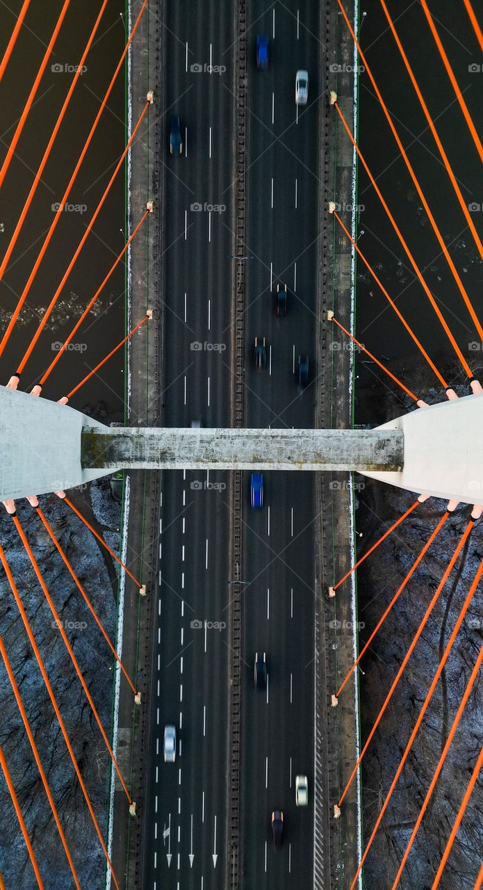 Aerial topdown view of siekierkowski bridge in Warszawa during winter. Bridge, traffic, river, winter.