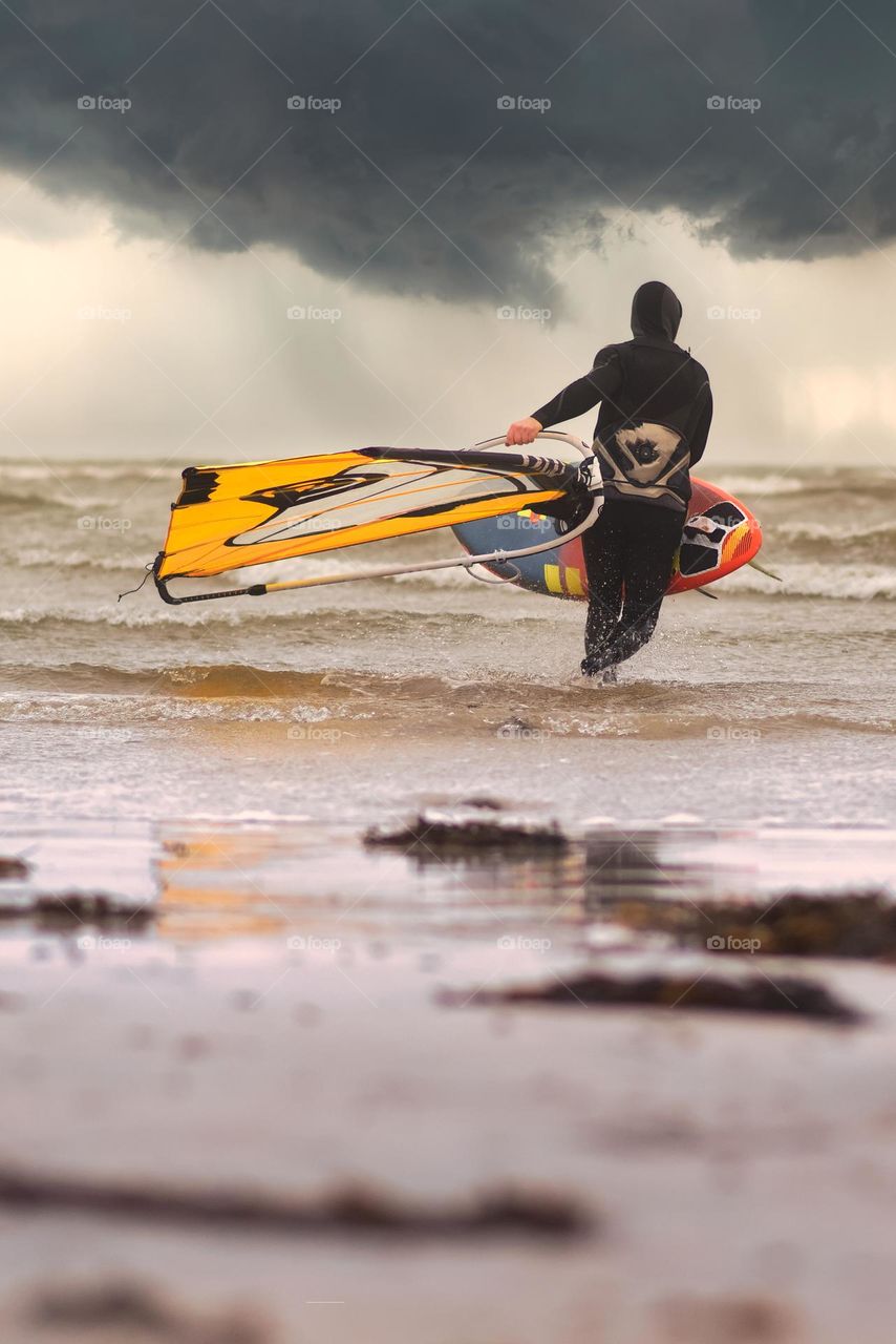 Surfer at Silver strand beach in Galway, Ireland