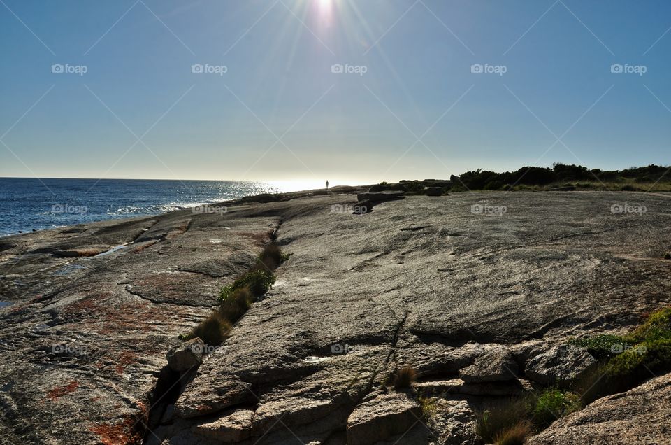 Afternoon sun setting on the ocean 