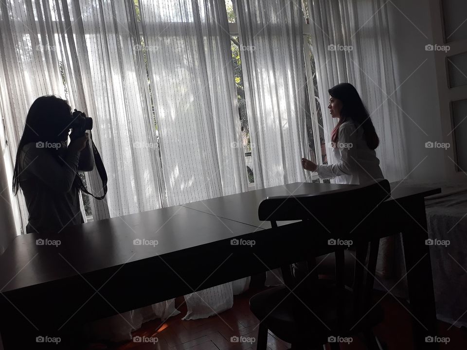 Photo shoot of a girl in front of the window