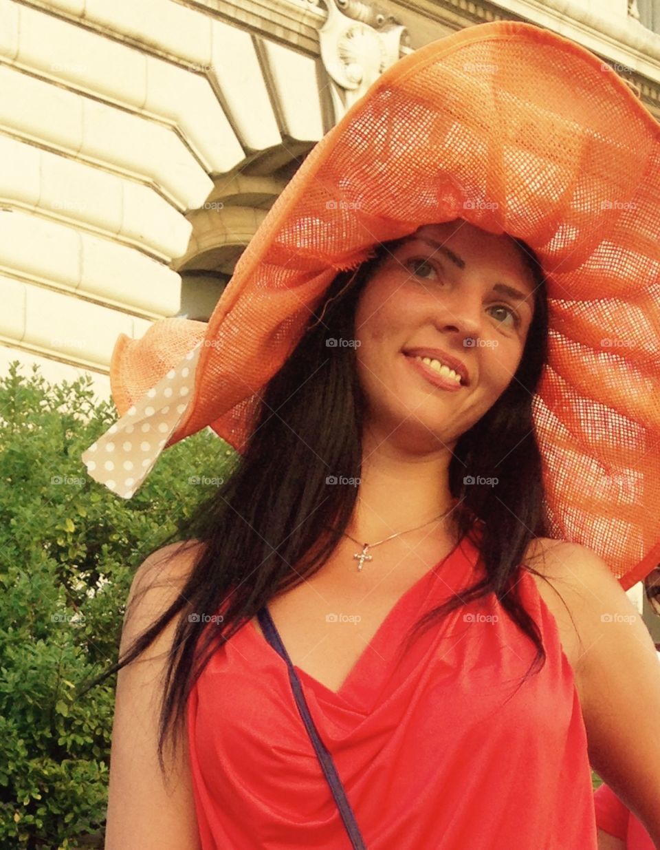 Smiling girl in the orange hat 