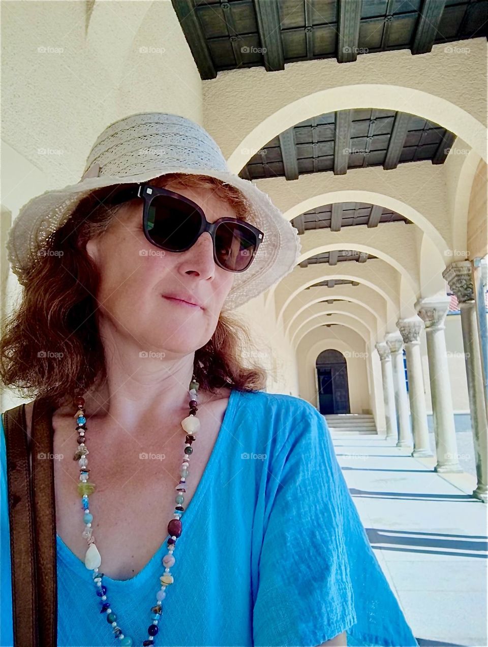 On a bright sunshiny summer day our lady visits the “North Cemetery” in “Munich”, capitol of “Bavaria” following a long corridor of arched sections with classical columns. 2024. Hypnotic Productions