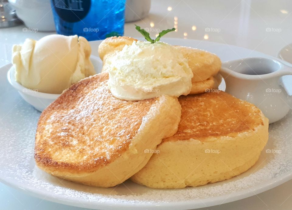 Dessert topping with wipcream served with vanilla ice cream