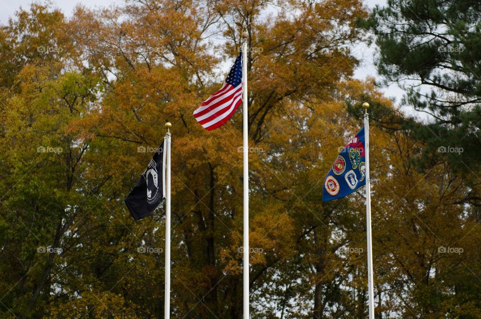 American Flag Flying with POW and Military Flags 