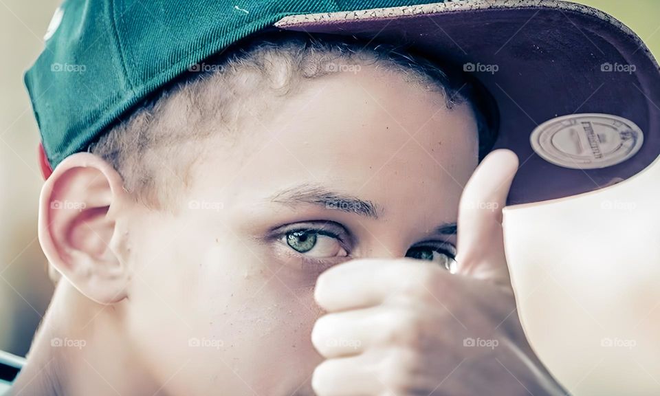 closeup of a boy's green eye