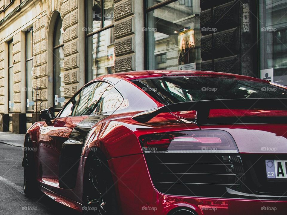 A picture with a beautiful red sport car