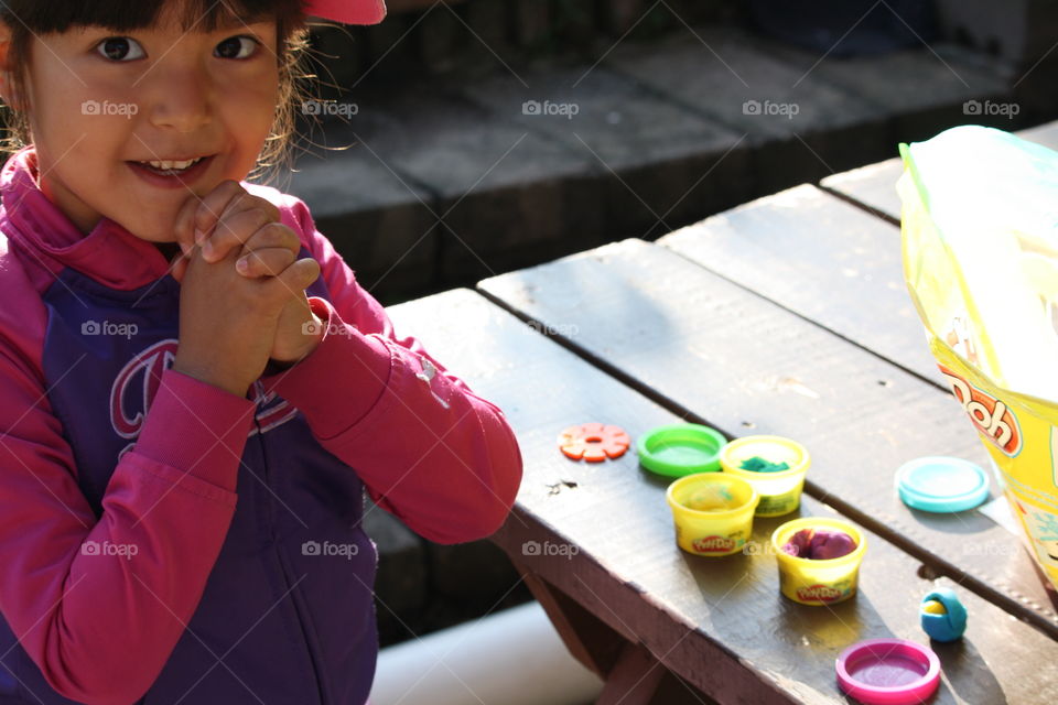 Little girl with playdough