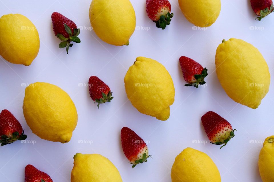 multiverse of lemons and strawberrys on a white background