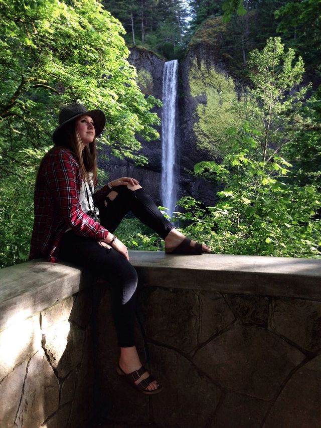 Girl by waterfall