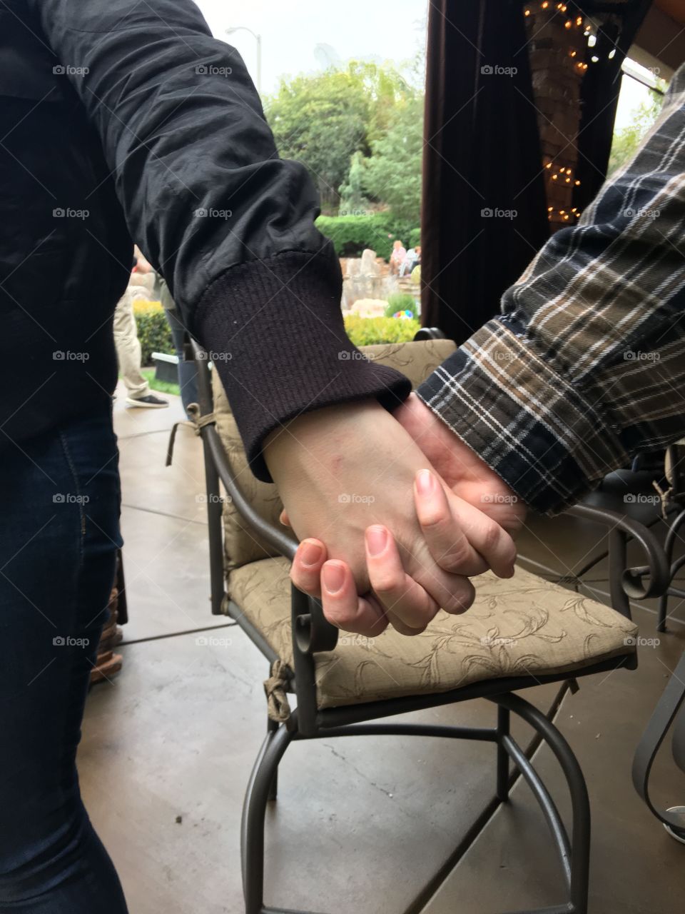Sweethearts holding hands 