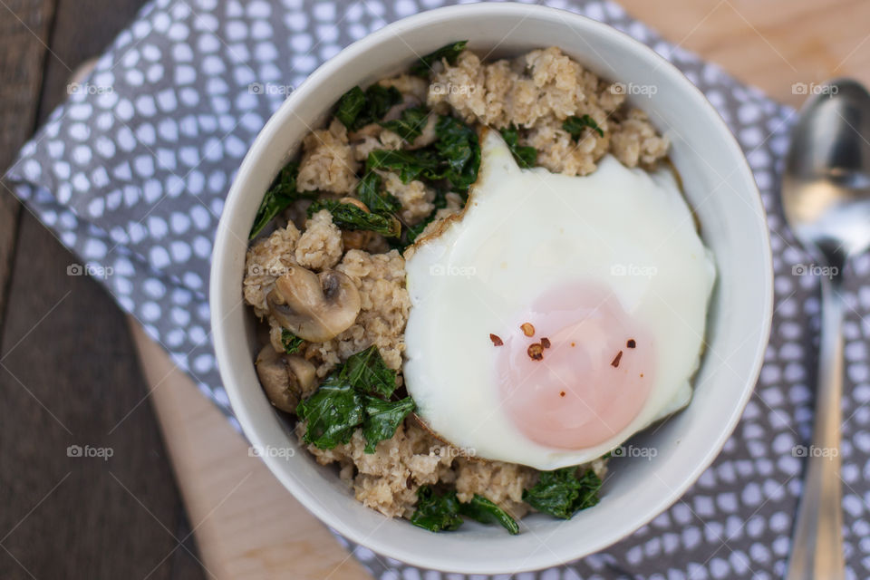 Savory oatmeal with kale, mushrooms and an egg