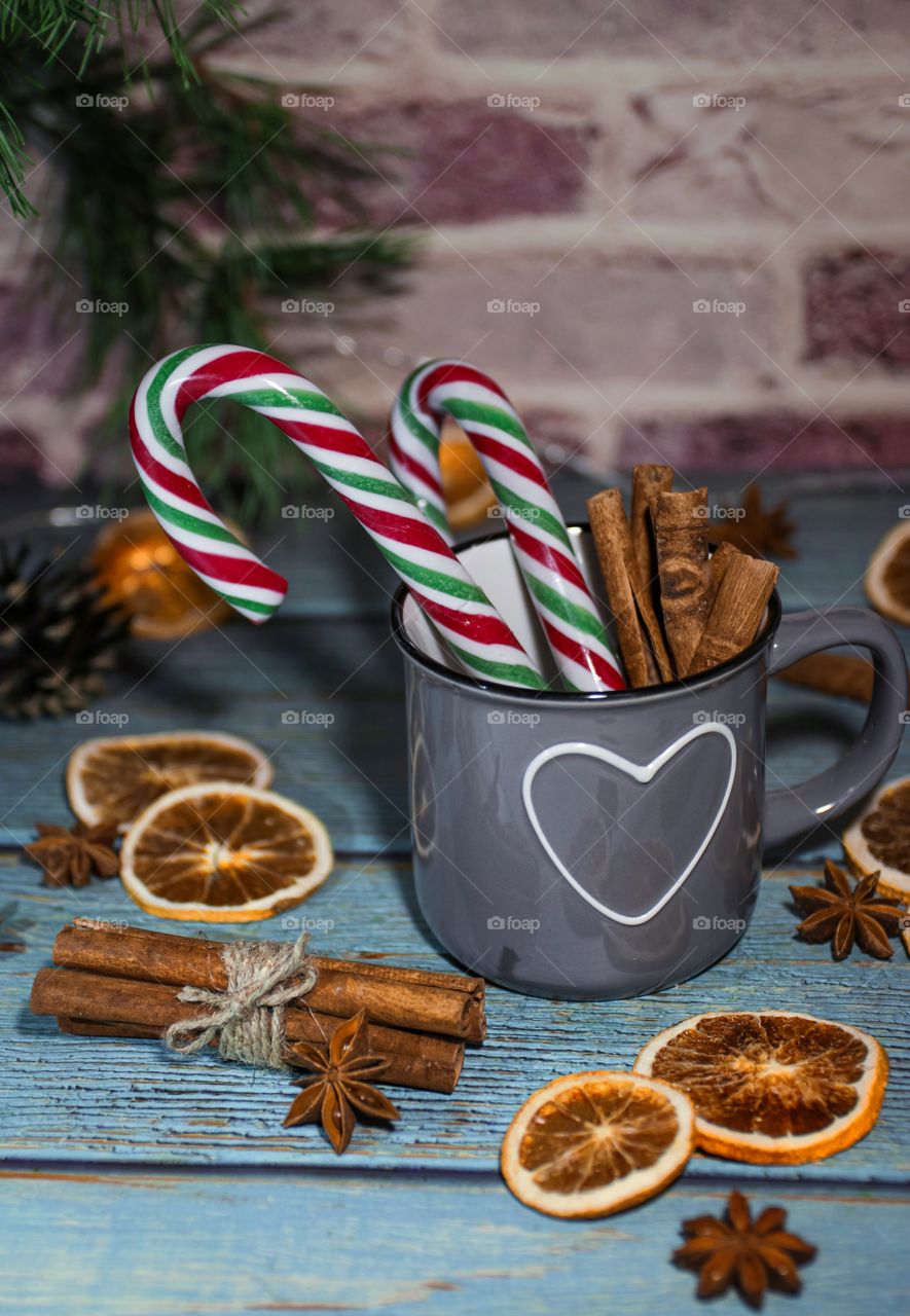 Christmas decorations of dried oranges on a wooden table