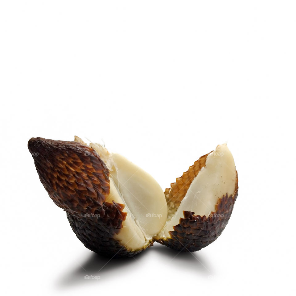 Sliced Zalacca fruit on white background