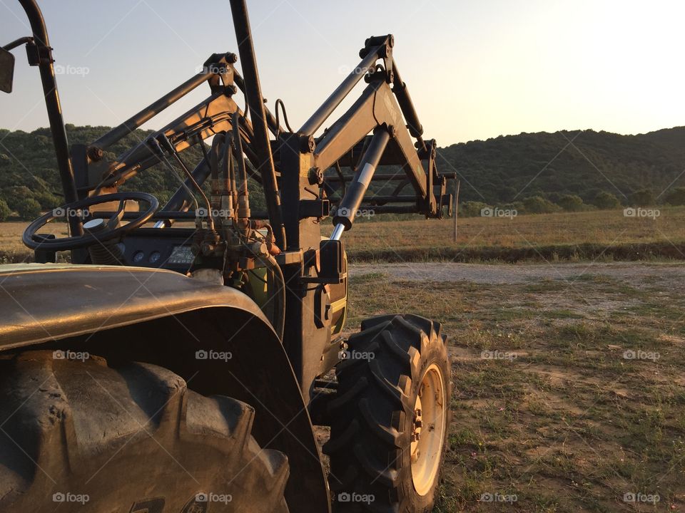 Agricultural tractor on a land