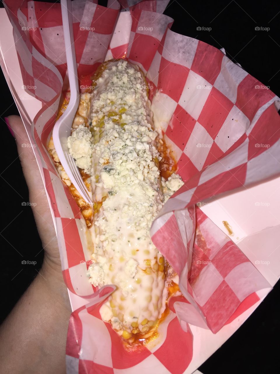 "Drunken Buffalo Corn on the Cob" from a BBQ food truck. Soaked in vodka and covered in buffalo hot sauce, butter, ranch dressing, and blue cheese crumbles. Delicious!