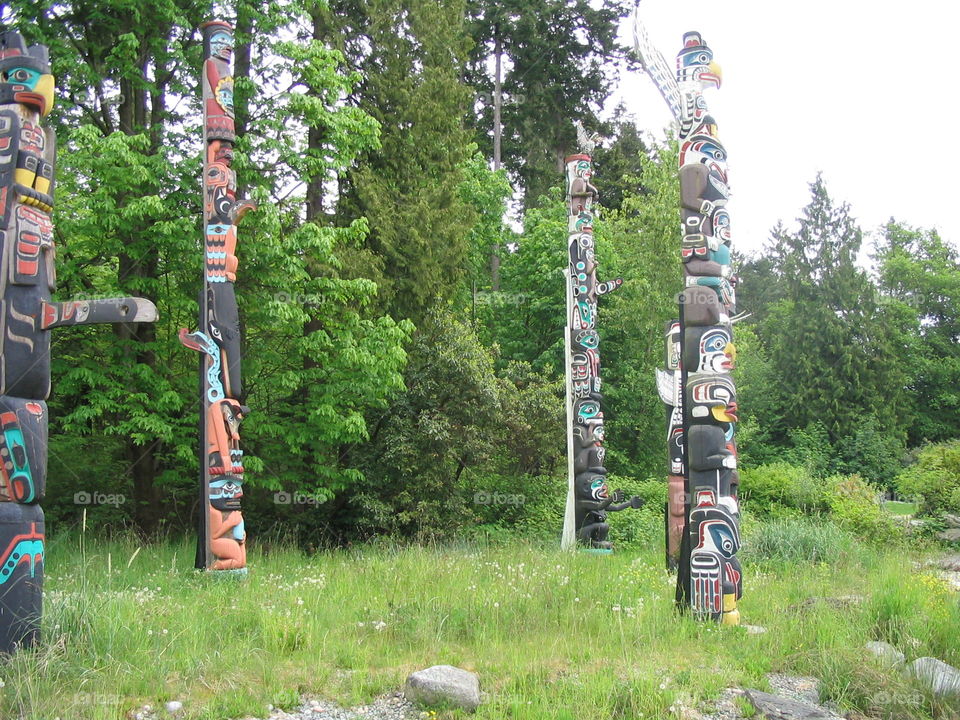 Totem Poles in the woods in Stanley Park, Vancouver, British Columbia