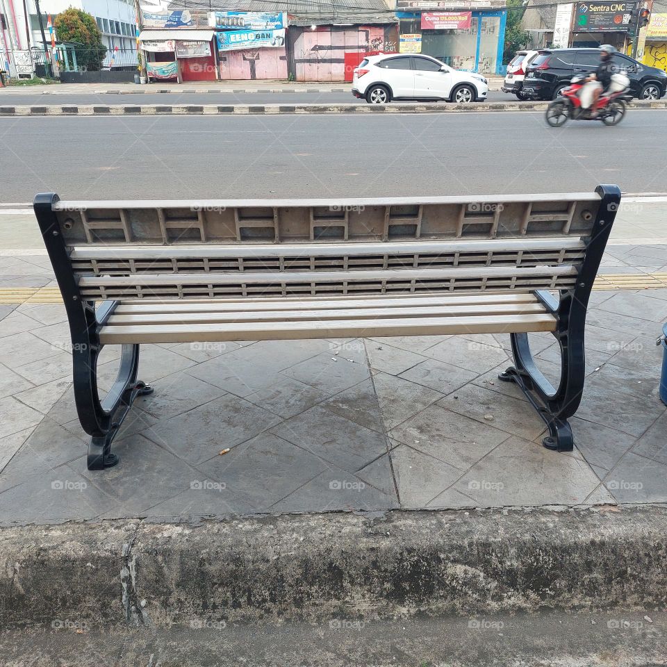 garden chairs placed on the side of the road