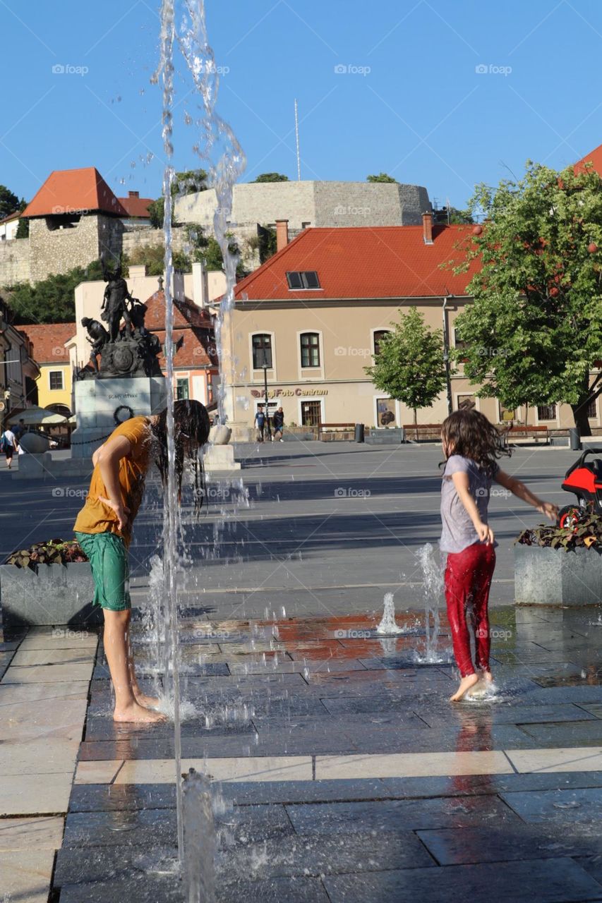 Having fun at city fountain 